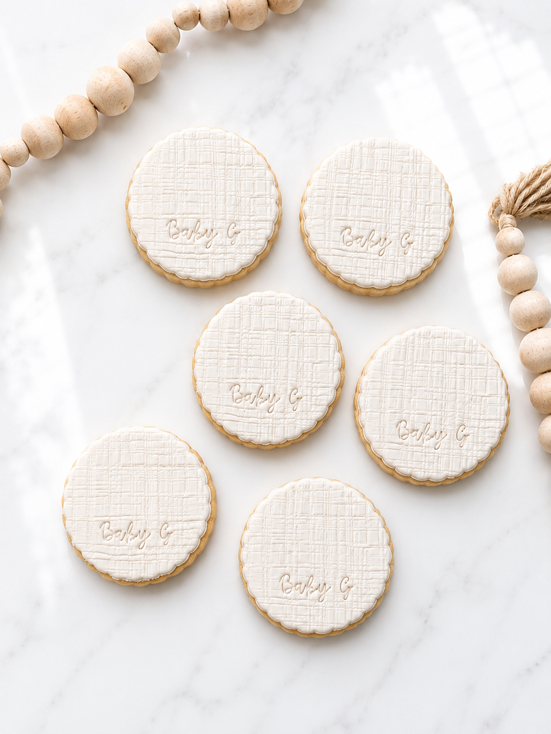 Texture scalloped baby initial fondant cookies