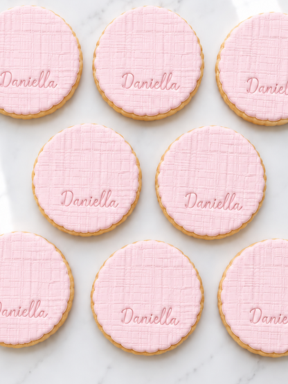 Scalloped baby, linen texture initial fondant cookies