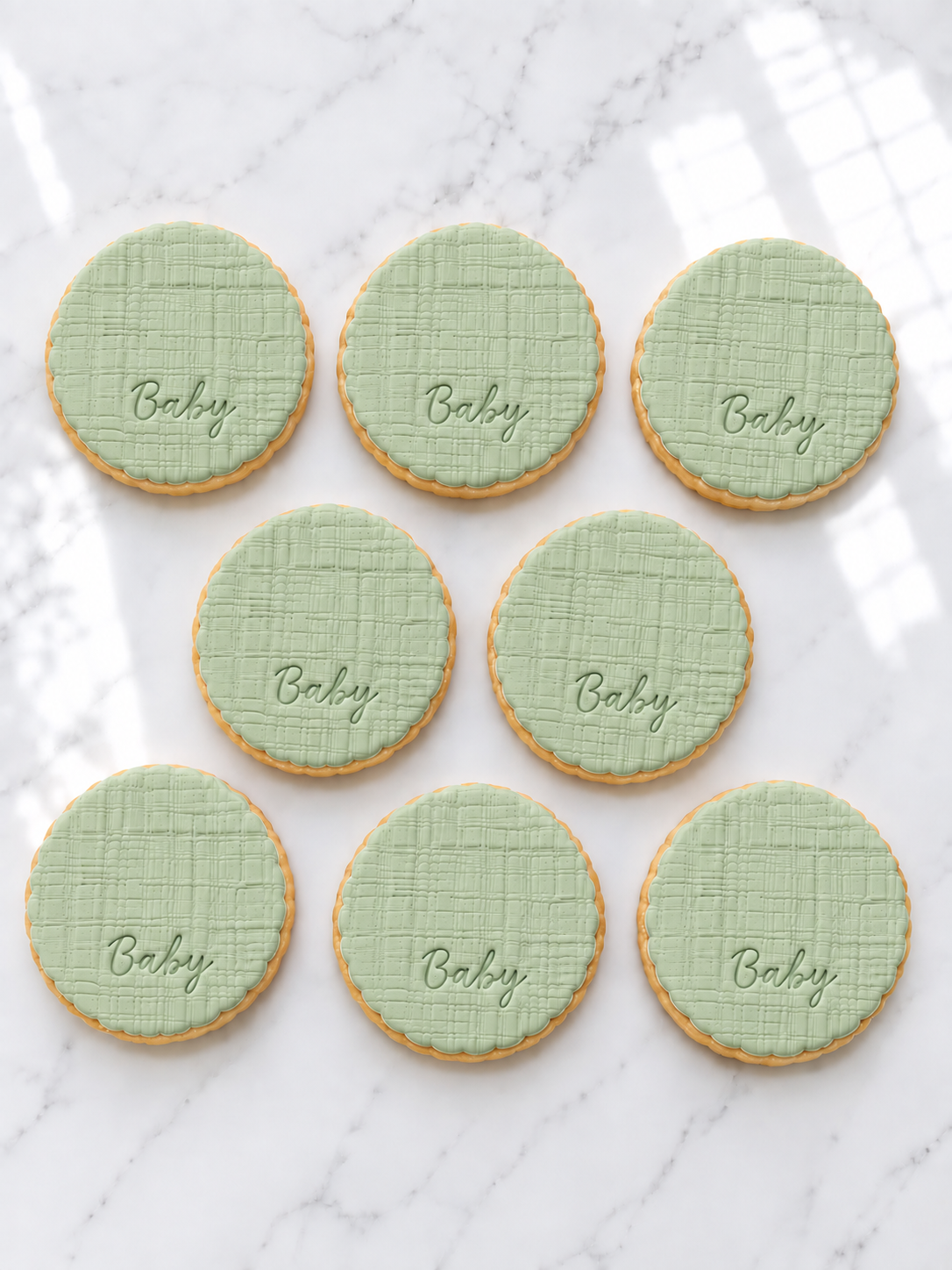 Scalloped baby, linen texture initial fondant cookies