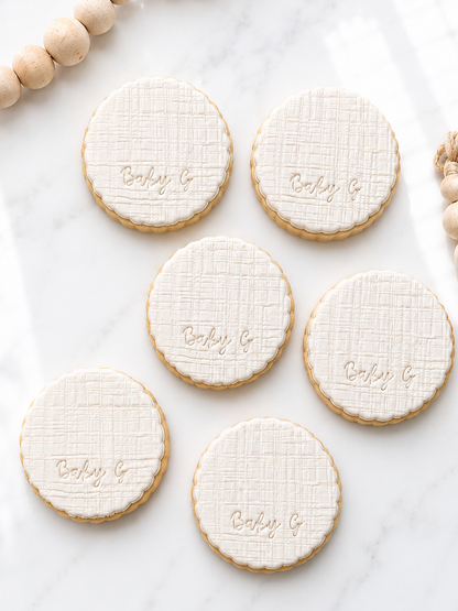 Scalloped baby, linen texture initial fondant cookies
